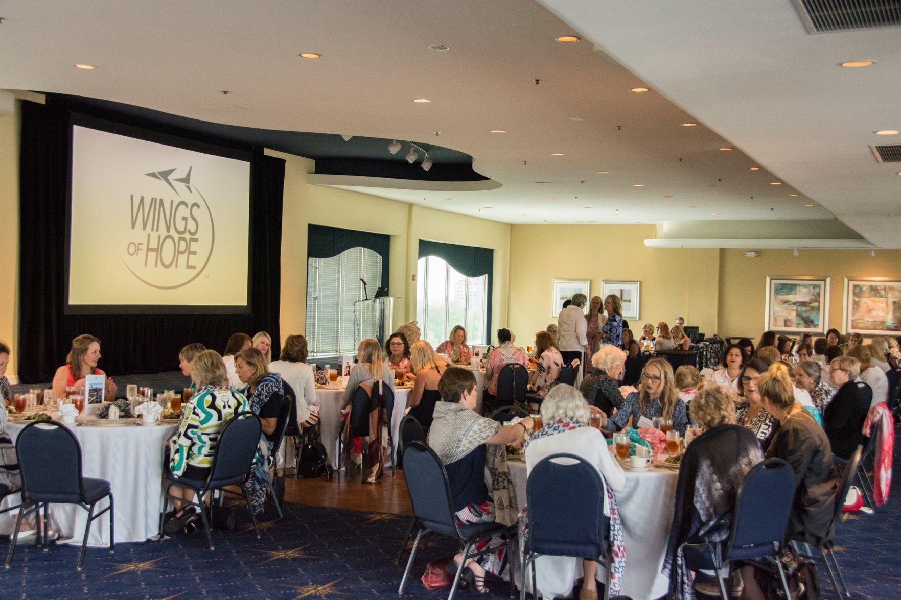 Guests chat and enjoy lunch during the Wings of Hope Ladies Luncheon